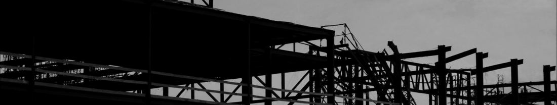 Steel scaffolding against a pale sky